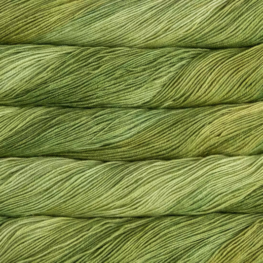 Close-up of twisted yarn strands in a variegated olive green and yellow-green colorway, filling the entire frame.