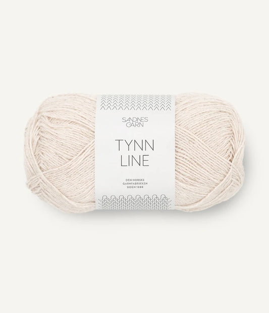 A ball of beige cotton/linen/viscose yarn labeled 'TYNN LINE' by Sandnes Garn