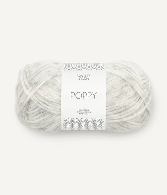 A ball of grey and white tonal alpaca, cotton, wool yarn labeled 'Poppy' by Sandnesgarn