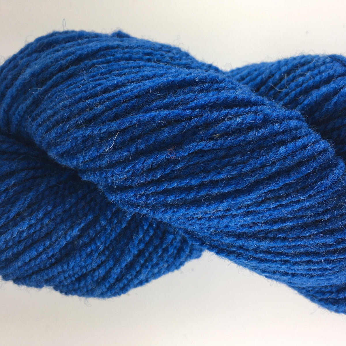 Close-up of a blue of rose coloured wool yarn