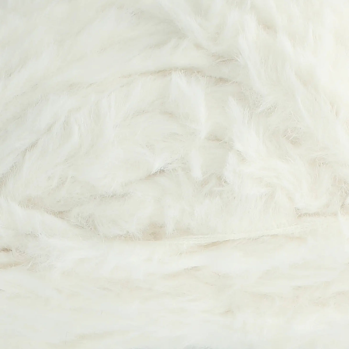 A skein of King Cole Velveteen polyester yarn in Velvet Snow white colour.