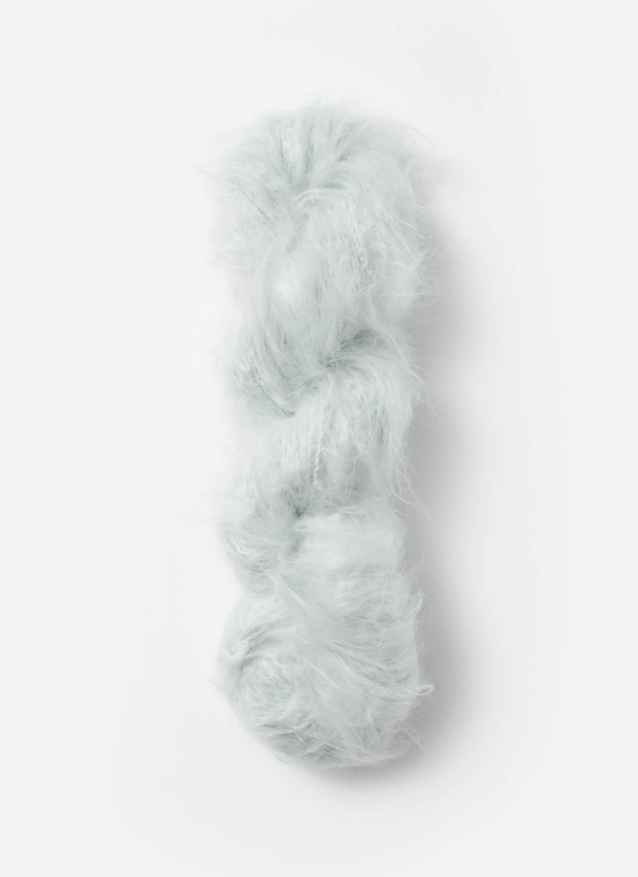 A white skein of brushed suri, merino, and bamboo yarn from Bluesky Fibers
