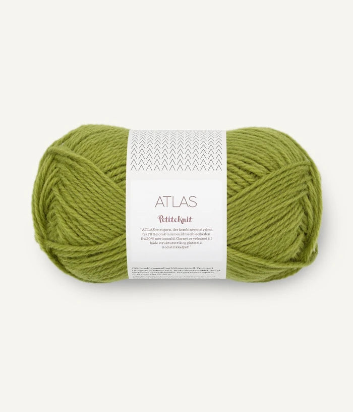 Green skein of yarn with a label on a white background