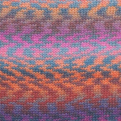 A knitted swatch of merino and nylon wool with a pattern of pink, orange, purple, and magenta colours