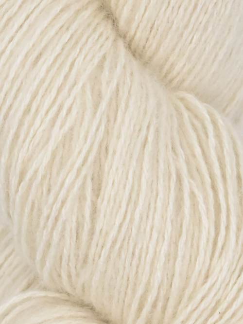 Close-up image of a skein of alpaca white colored cotton yarn.