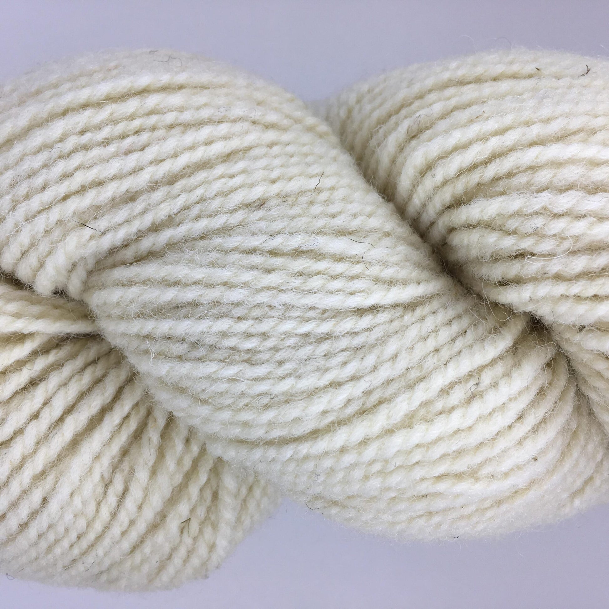 Close-up of a skein of white coloured wool yarn