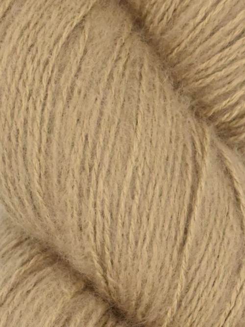 Close-up image of a skein of quinoa brown colored cotton yarn.