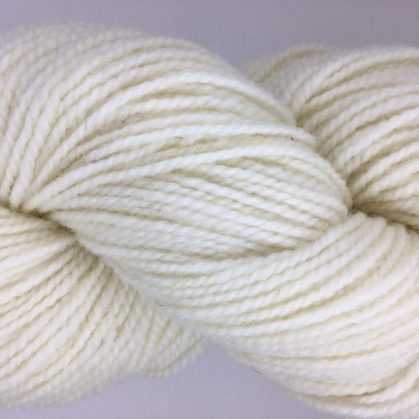 Close-up of a skein of bright white coloured wool yarn