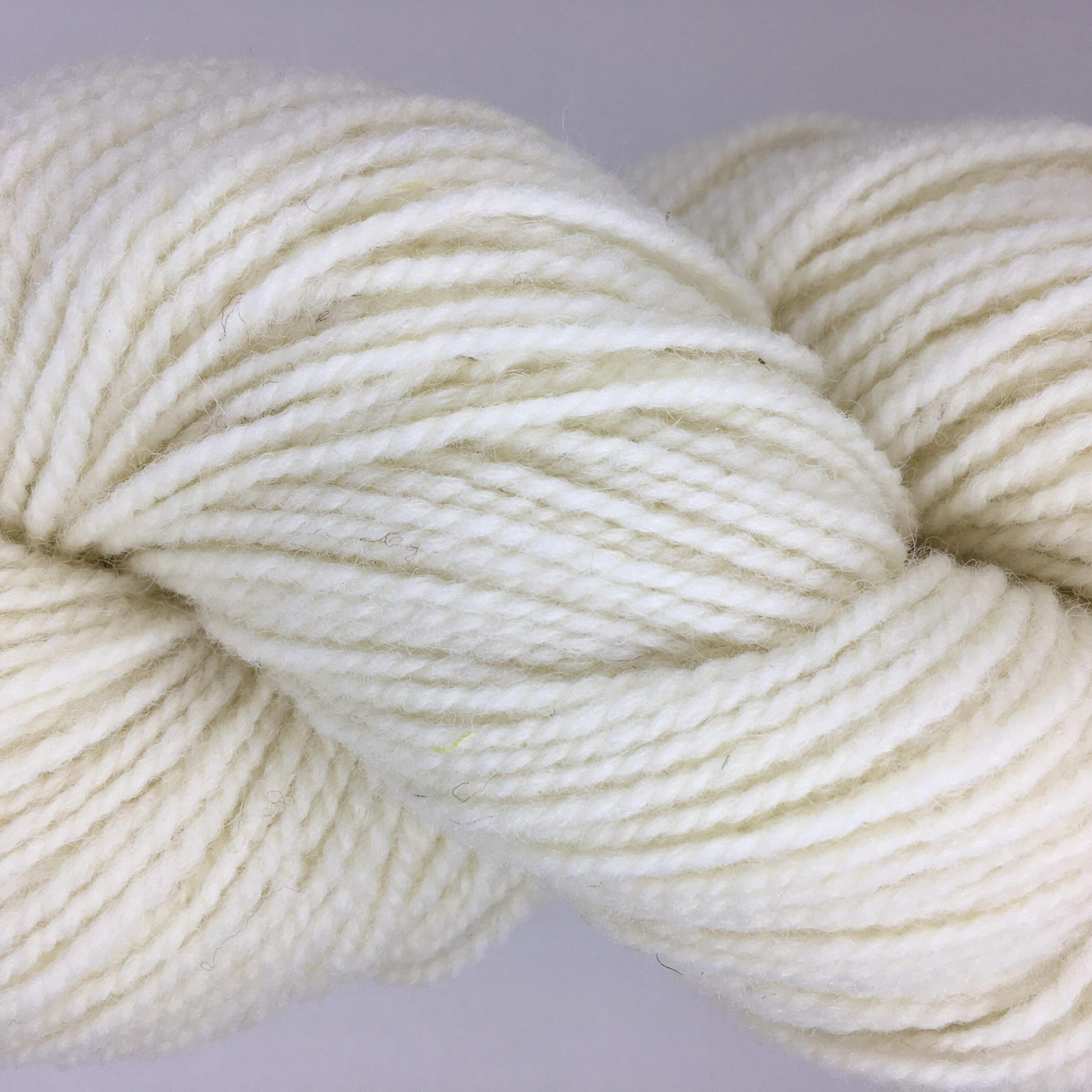 Close-up of a skein of bright white coloured wool yarn