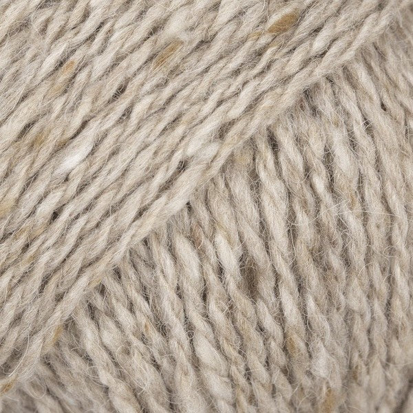 Close-up of beige wool/alpaca/viscose yarn from Drops