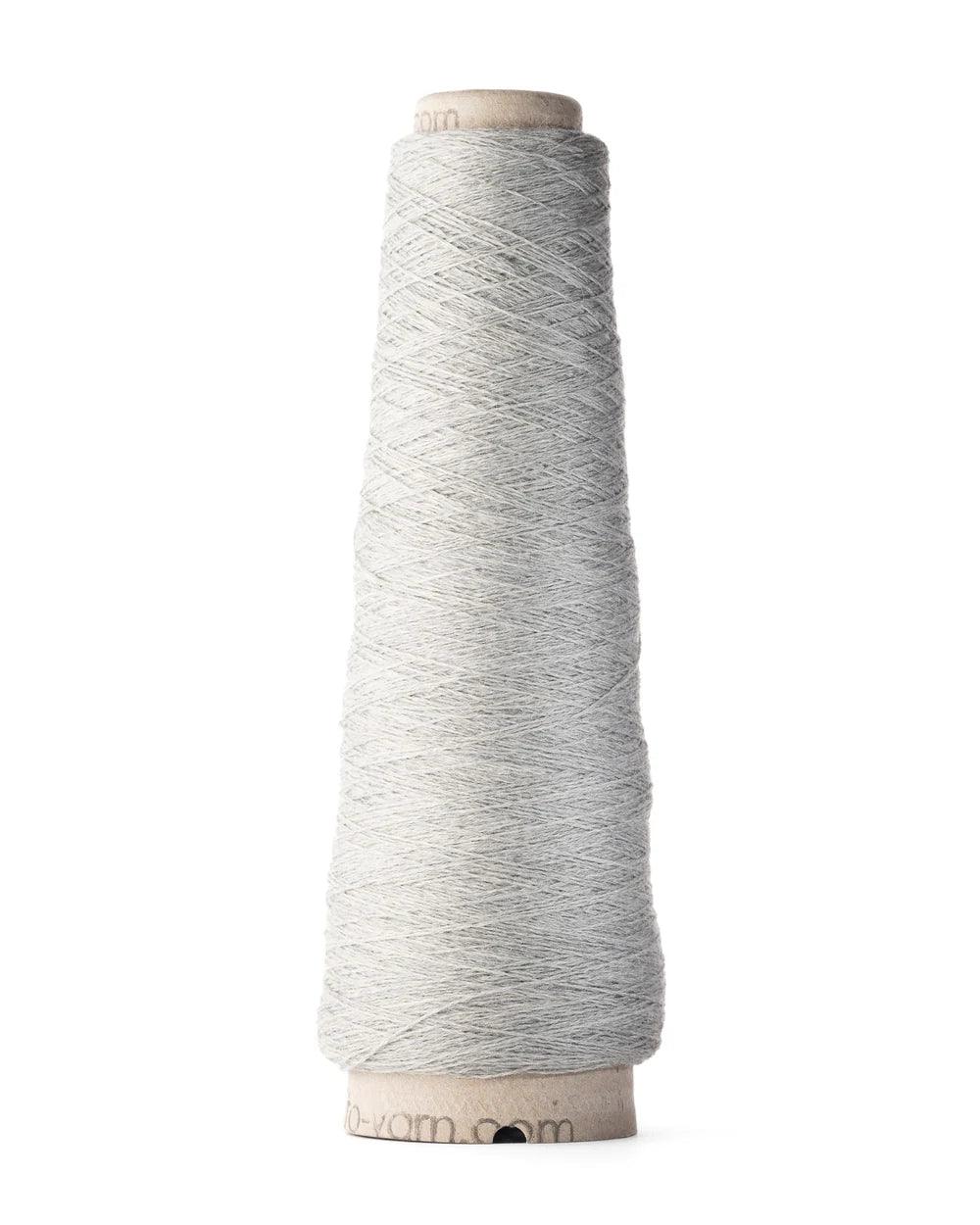 A spool of grey merino wool fingering weight yarn.