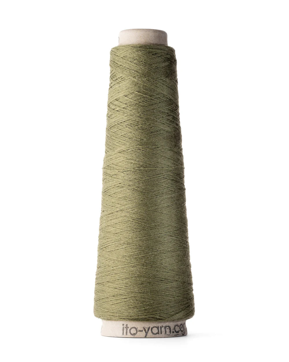 A spool of cam green merino wool fingering weight yarn.