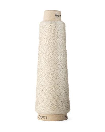 A spool of angora white merino wool fingering weight yarn.