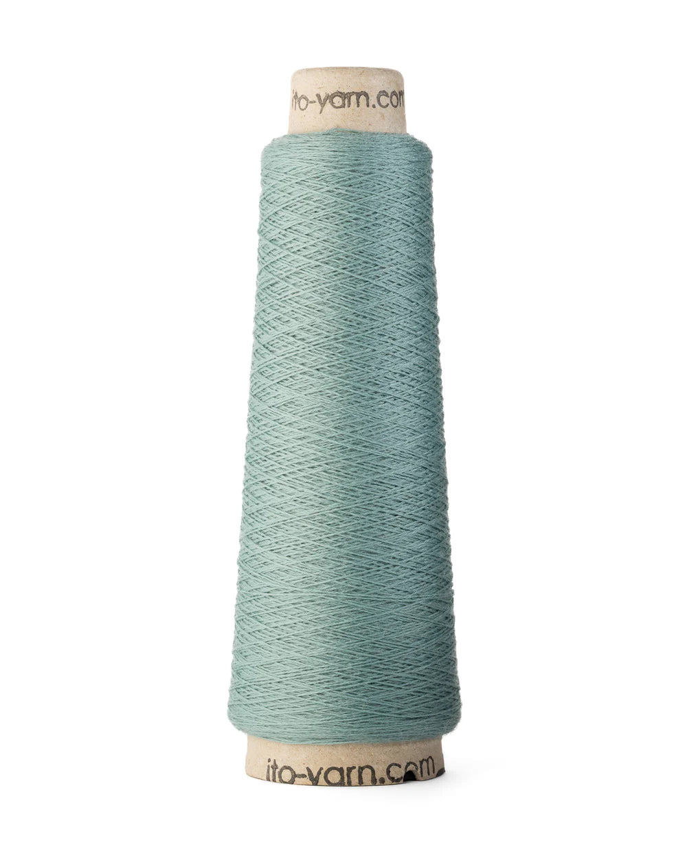 A spool of agua blue merino wool fingering weight yarn.