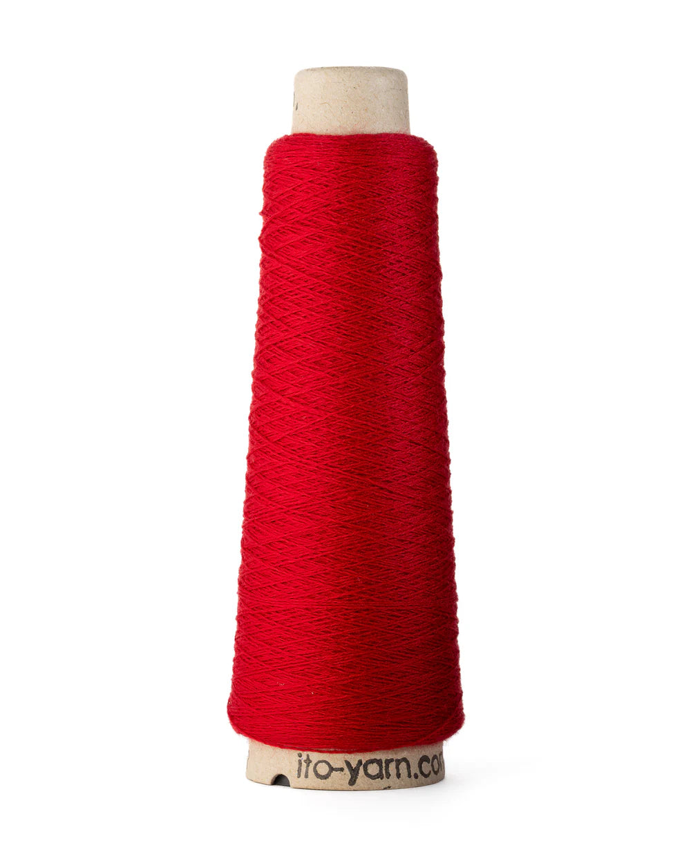 A spool of red merino wool fingering weight yarn.