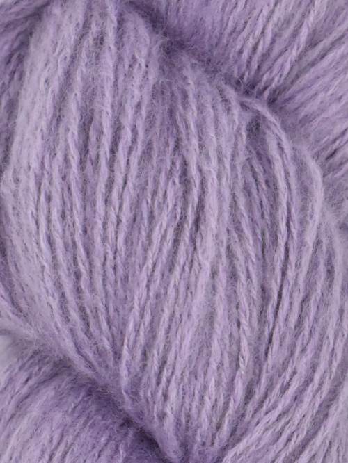 Close-up image of a skein of moonflower purple colored cotton yarn.