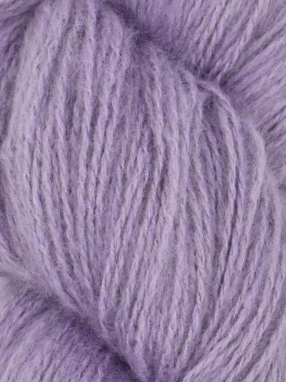 Close-up image of a skein of moonflower purple colored cotton yarn.