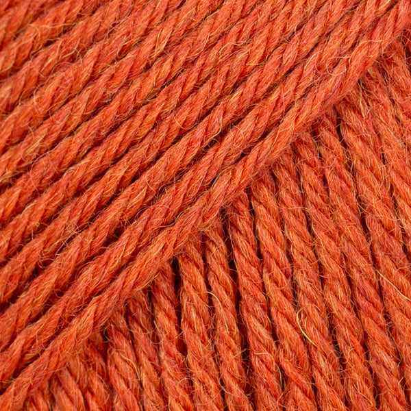 Close-up of orange-red wool and alpaca yarn from Drops