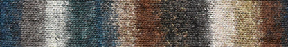 Knitted fabric swatch with a gradient of brown, gray, and blue colors.
