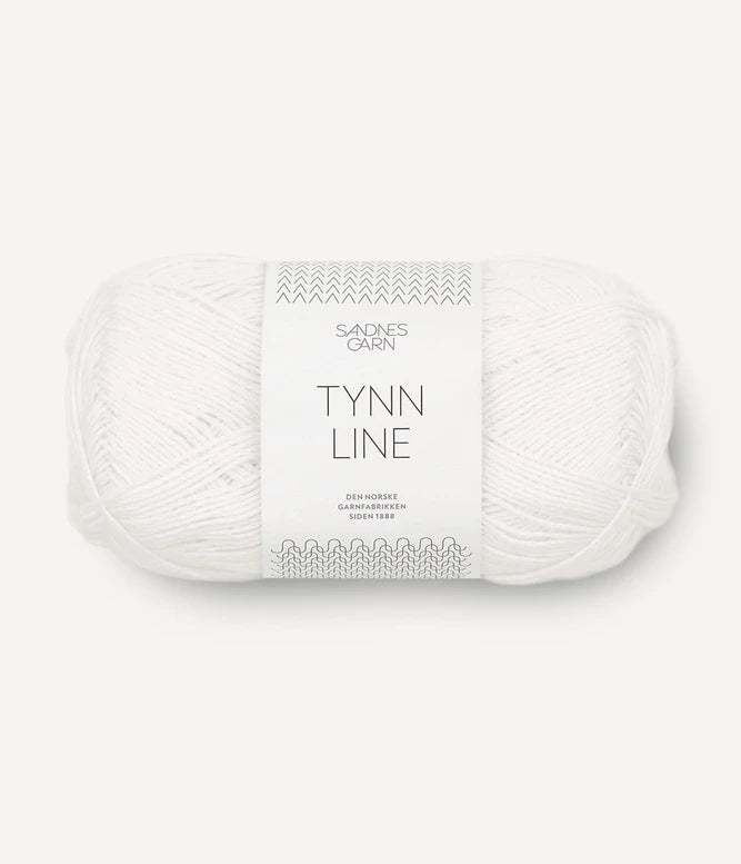 A ball of white cotton/linen/viscose yarn labeled 'TYNN LINE' by Sandnes Garn