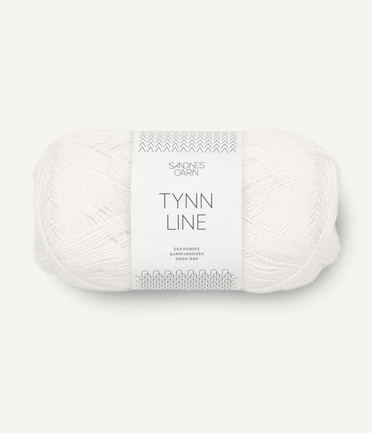 A ball of white cotton/linen/viscose yarn labeled 'TYNN LINE' by Sandnes Garn