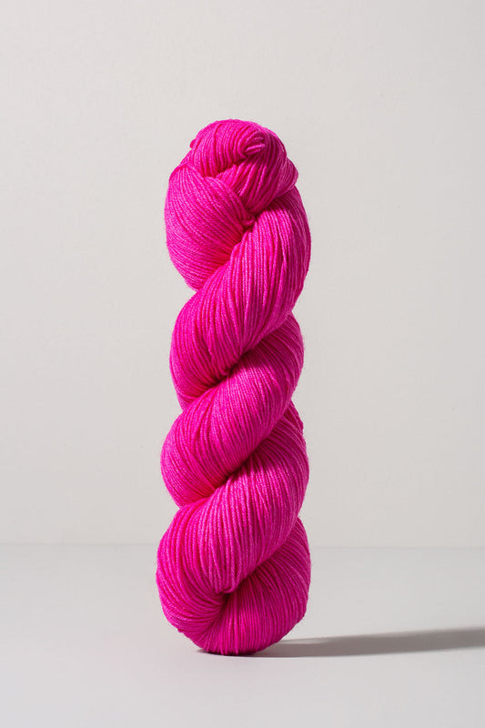 hot pink skein of merino and nylon yarn from Urth