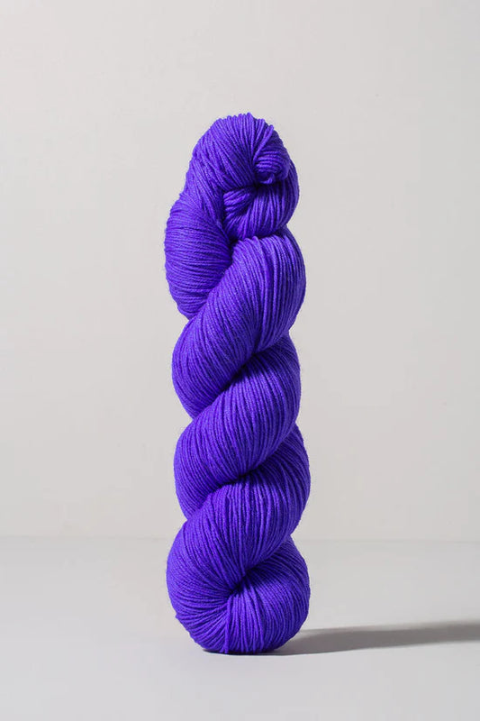 Bright purple skein of merino and nylon yarn from Urth
