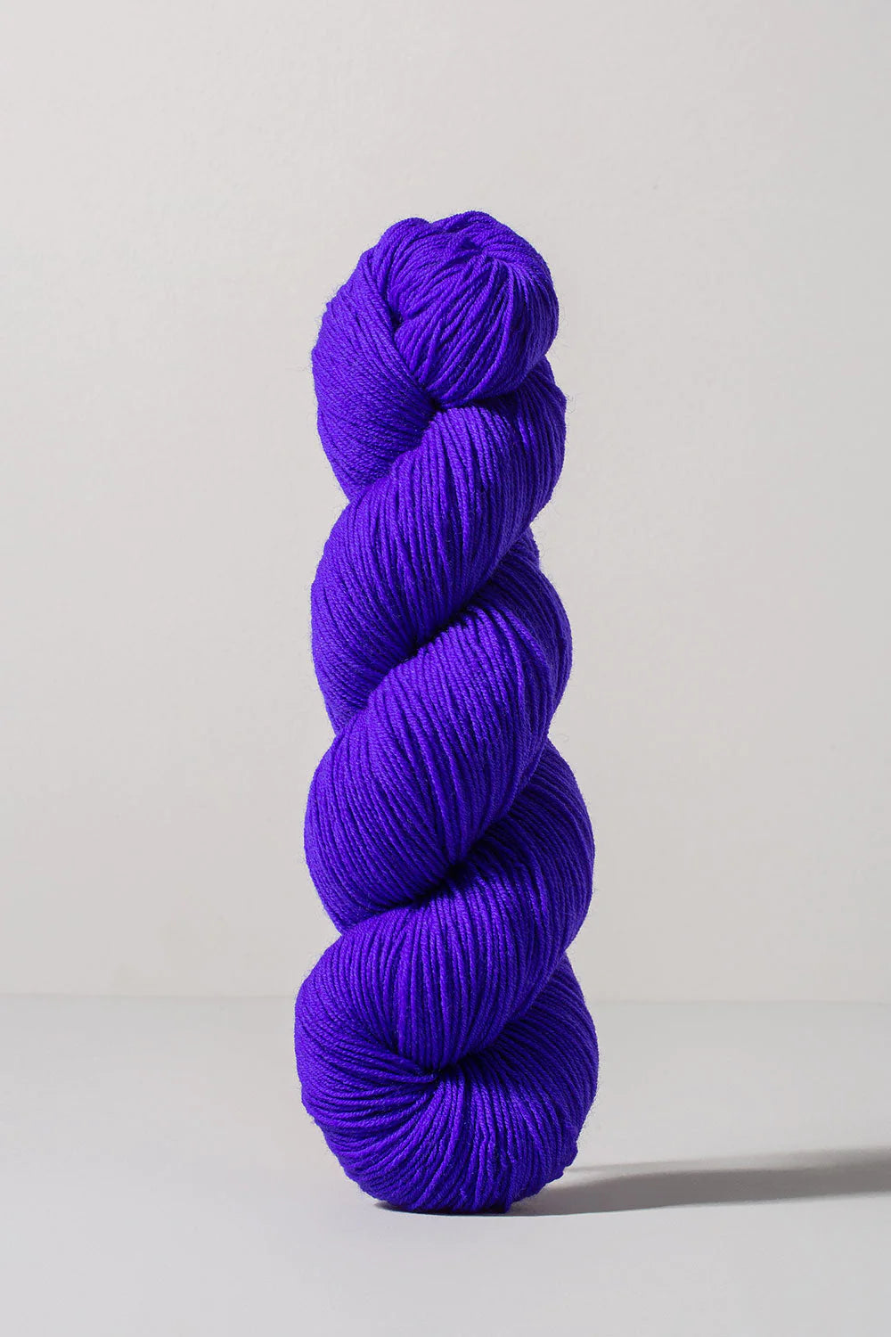 Rich purple skein of merino and nylon yarn from Urth