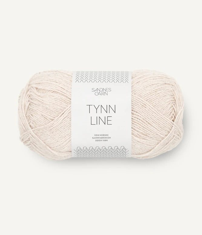 A ball of beige cotton/linen/viscose yarn labeled 'TYNN LINE' by Sandnes Garn
