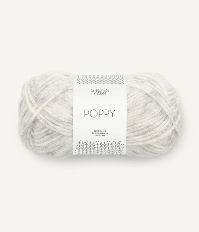 A ball of grey and white tonal alpaca, cotton, wool yarn labeled 'Poppy' by Sandnesgarn