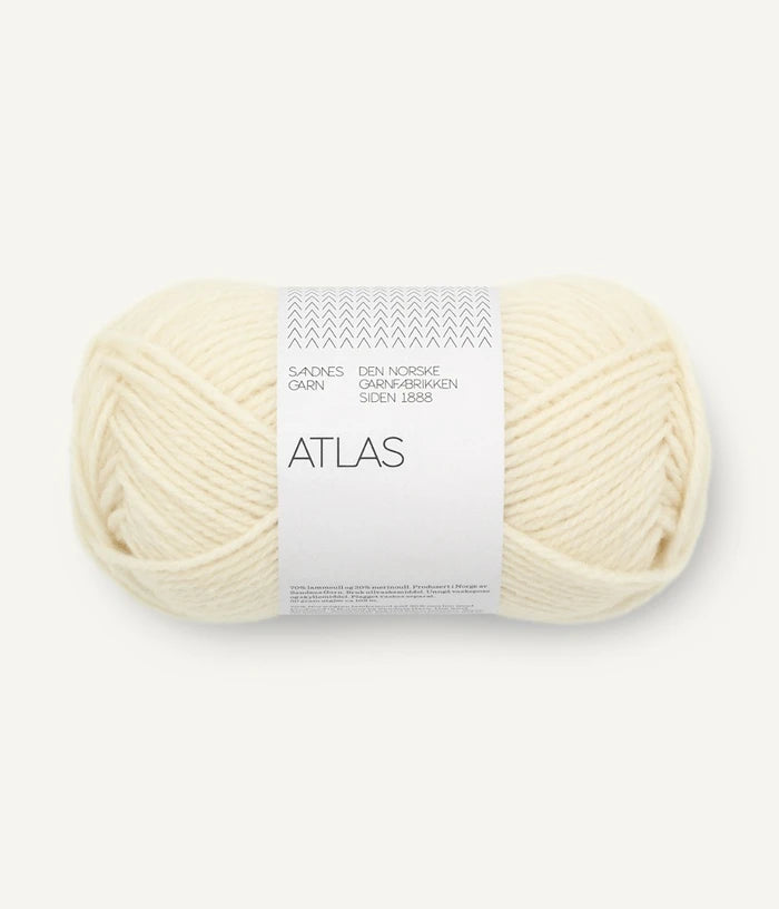Ball of cream-colored yarn with 'Atlas' label on a white background