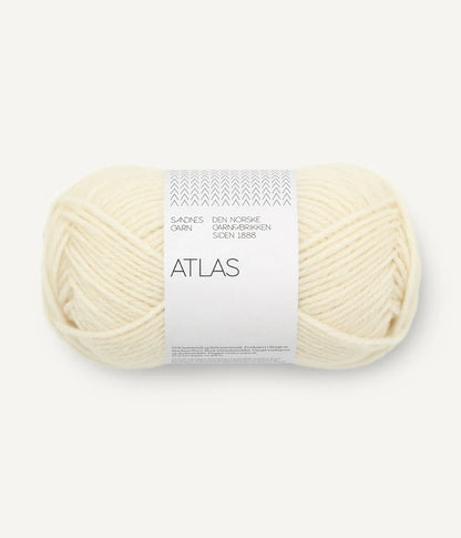 Ball of cream-colored yarn with 'Atlas' label on a white background
