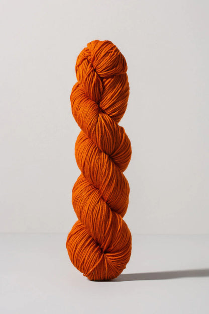 Dark orange skein of merino and nylon yarn from Urth