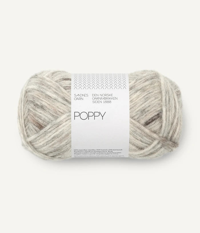 A ball of brown and grey tonal alpaca, cotton, wool yarn labeled 'Poppy' by Sandnesgarn