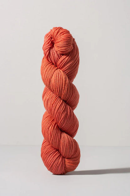 Peach skein of merino and nylon yarn from Urth