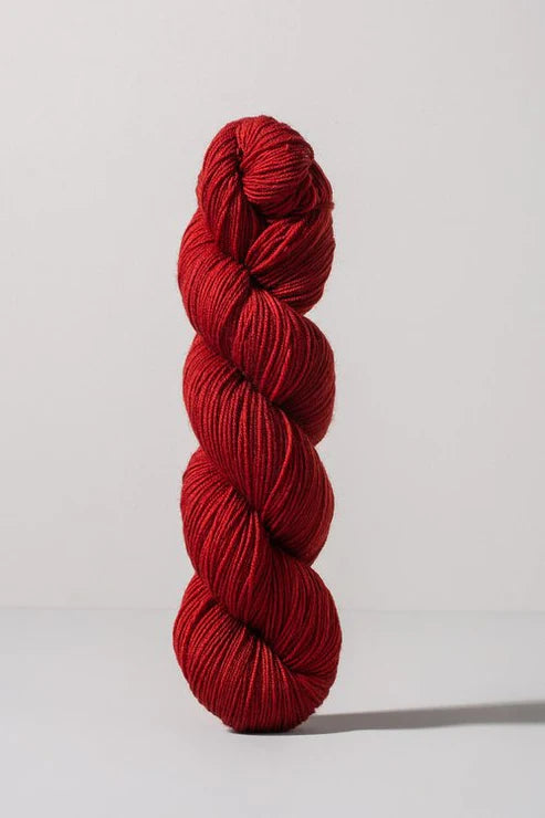 Red skein of merino and nylon yarn from Urth