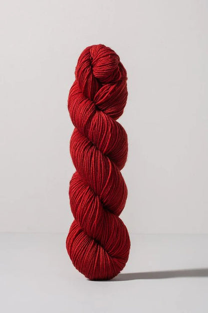 Red skein of merino and nylon yarn from Urth