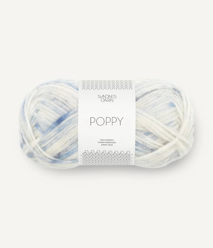 A ball of blue and white tonal alpaca, cotton, wool yarn labeled 'Poppy' by Sandnesgarn
