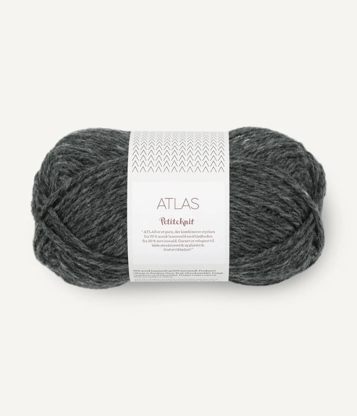 Gray skein of yarn with a label on a white background