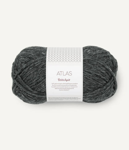 Gray skein of yarn with a label on a white background