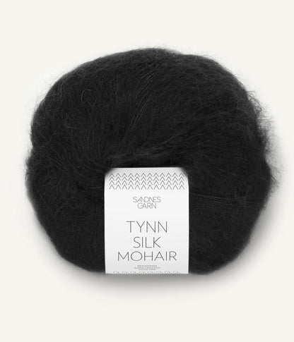 A ball of Tynn Silk Mohair yarn in a black color with a 'Tynn Silk Mohair' label from Sandnes Garn