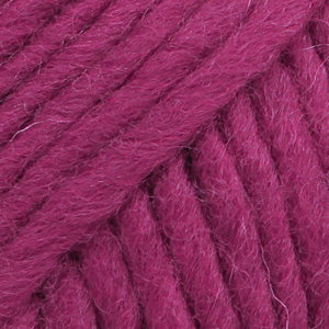 Close-up of a ball of raspberry-colored wool yarn from Drops