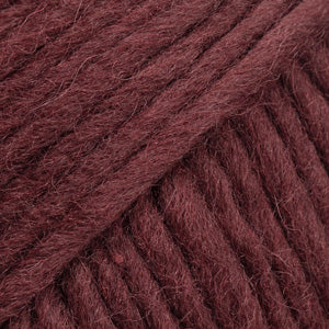 Close-up of a ball of brown-red-colored wool yarn from Drops