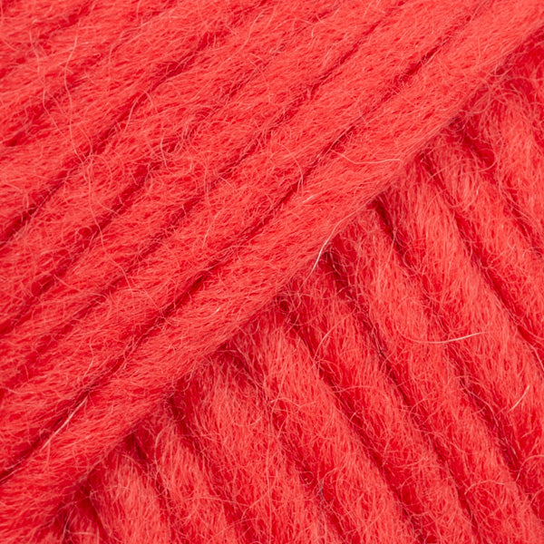 Close-up of a ball of bright red-colored wool yarn from Drops
