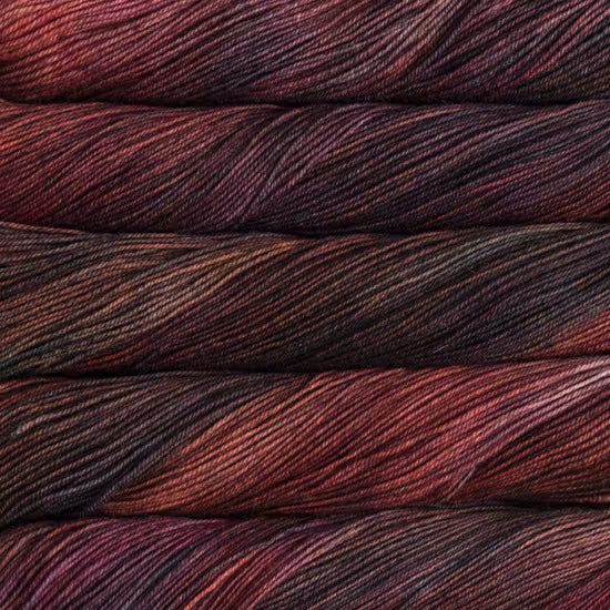 Close-up of multicolored yarn with shades of red and brown.