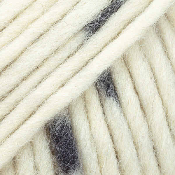 Close-up of a ball of black and white-colored wool yarn from Drops