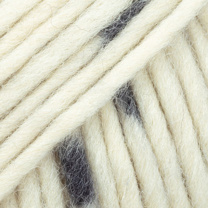 Close-up of a ball of black and white-colored wool yarn from Drops