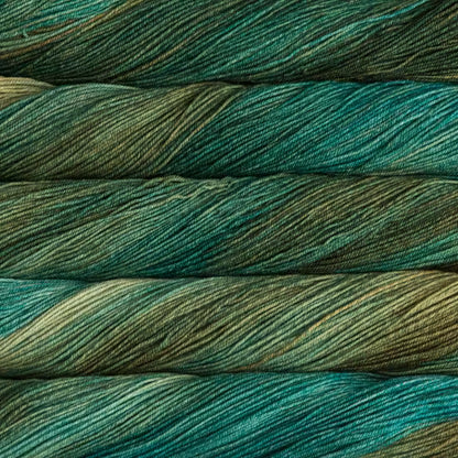 Close-up of green and blue yarn skeins