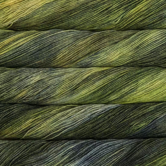 Close-up of folded yarn strands showing a variegated color pattern of olive green, dark gray, and black.