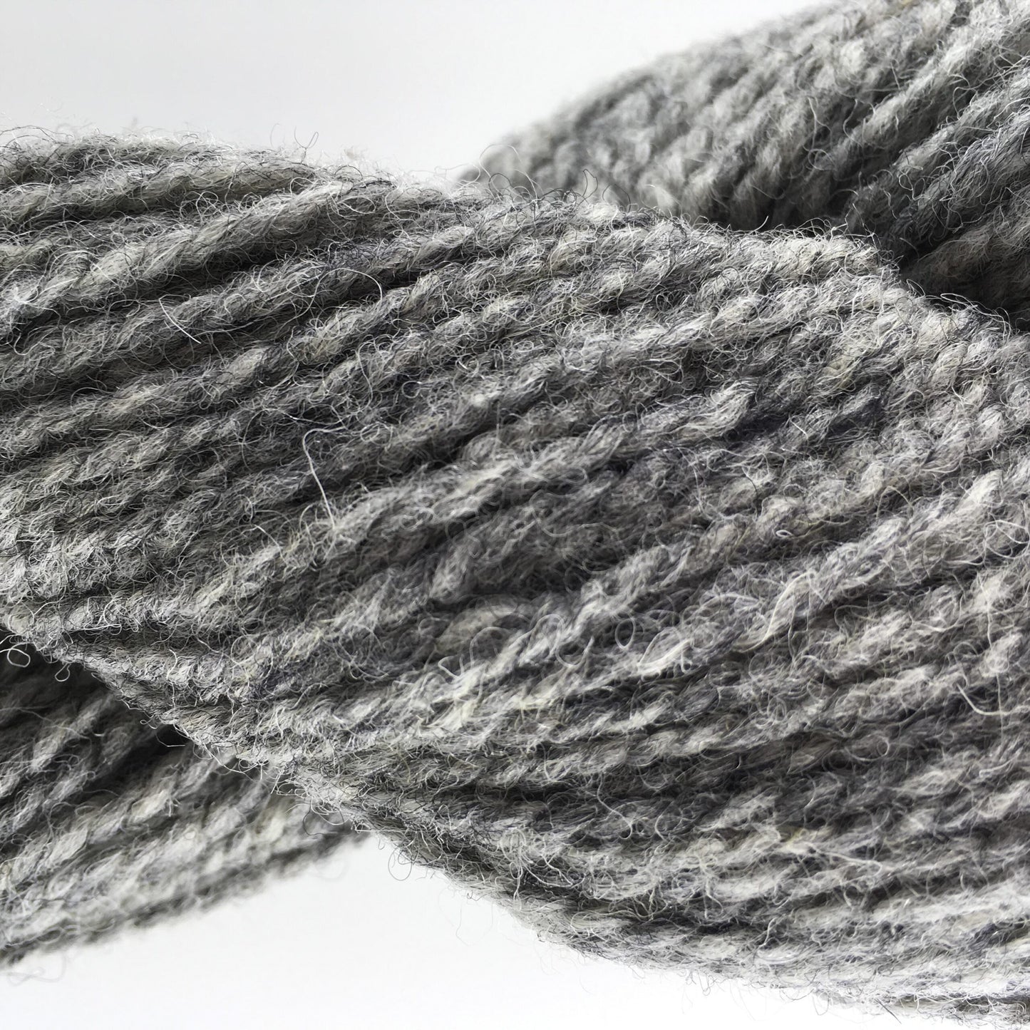 Close-up of a skein of light grey coloured wool yarn